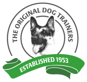 Karenswood Logo - A German Shepherd dog's head is depicted within a circular logo. The logo text reads, "THE ORIGINAL DOG TRAINERS". A green banner below the circle reads "ESTABLISHED 1953."